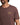 Man wearing a brown t-shirt with a logo on a white background