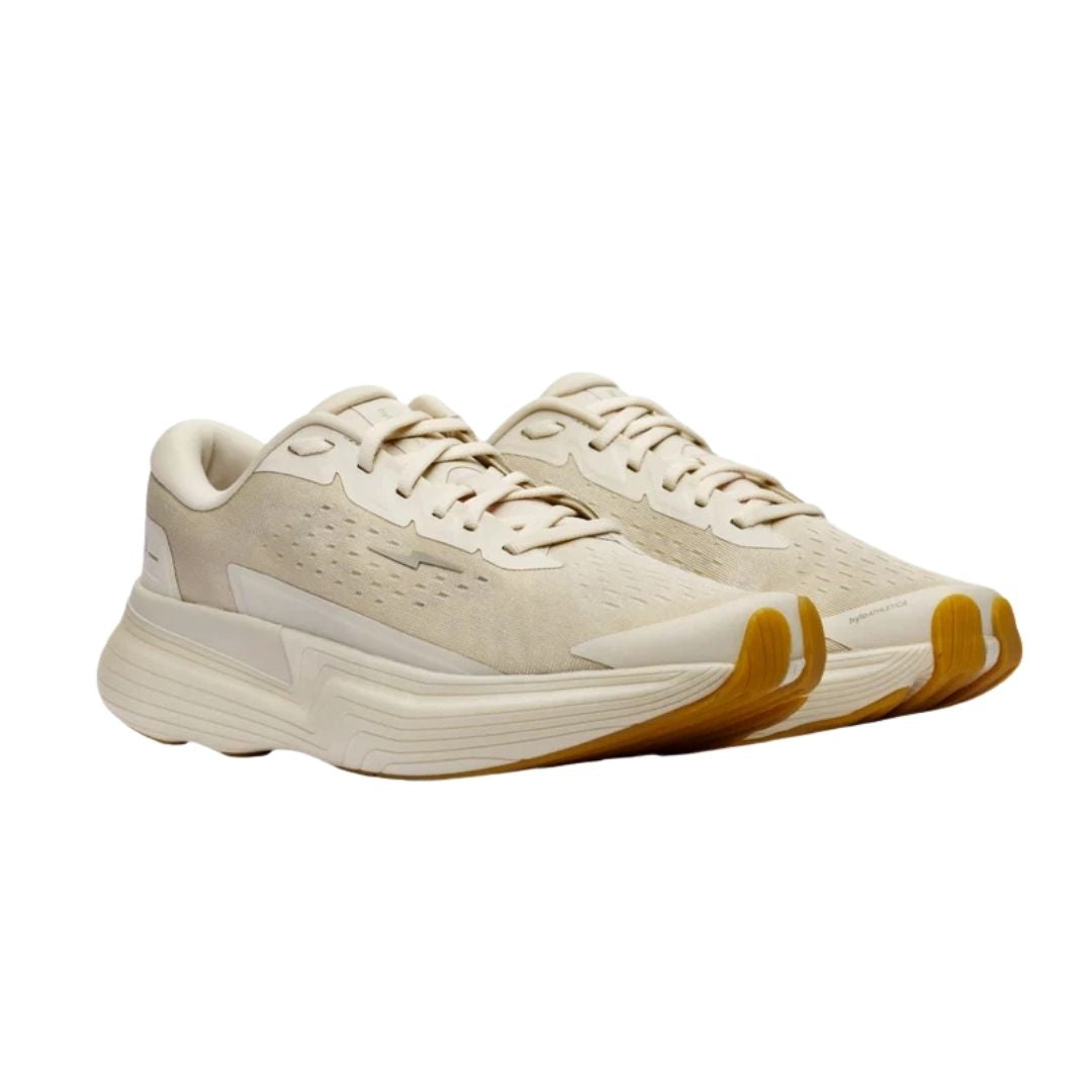 Hylo Axis running shoe in Sand/Oat, medial view showing the natural rubber outsole