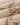 Filson Women's Wildlife Wool Sweater in Cream / Brown, showing the rib-knit cuffs and hem