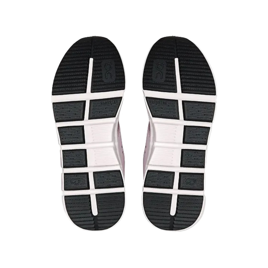 Outsole of the On Kids' Cloud Play in Orchid/White, showing the wide flex grooves and black rubber wear pads