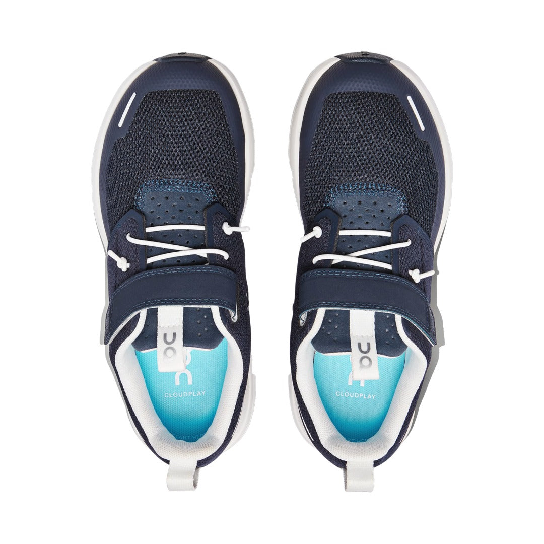 Top-down view of a pair of On Kids' Cloud Play shoes in Midnight/White, showing the pale blue CLOUDPLAY sockliner and elastic laces
