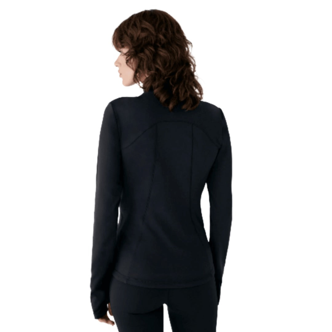 Back view of a woman wearing a black, fitted Lolë Eco Power Tech jacket with a stand collar and curved hem.