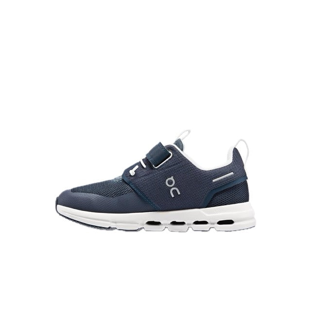 On Kids' Cloud Play in Midnight/White, side profile showing the strap closure and Cloud elements in the midsole